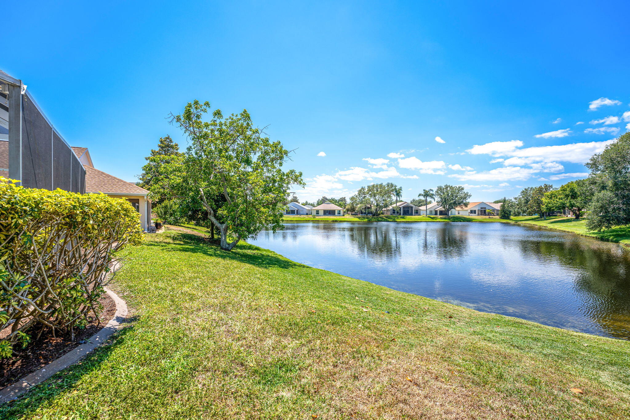 981 Shaw Circle Melbourne, FL 32940 - Photo 46 of 58 a view of a lake with houses