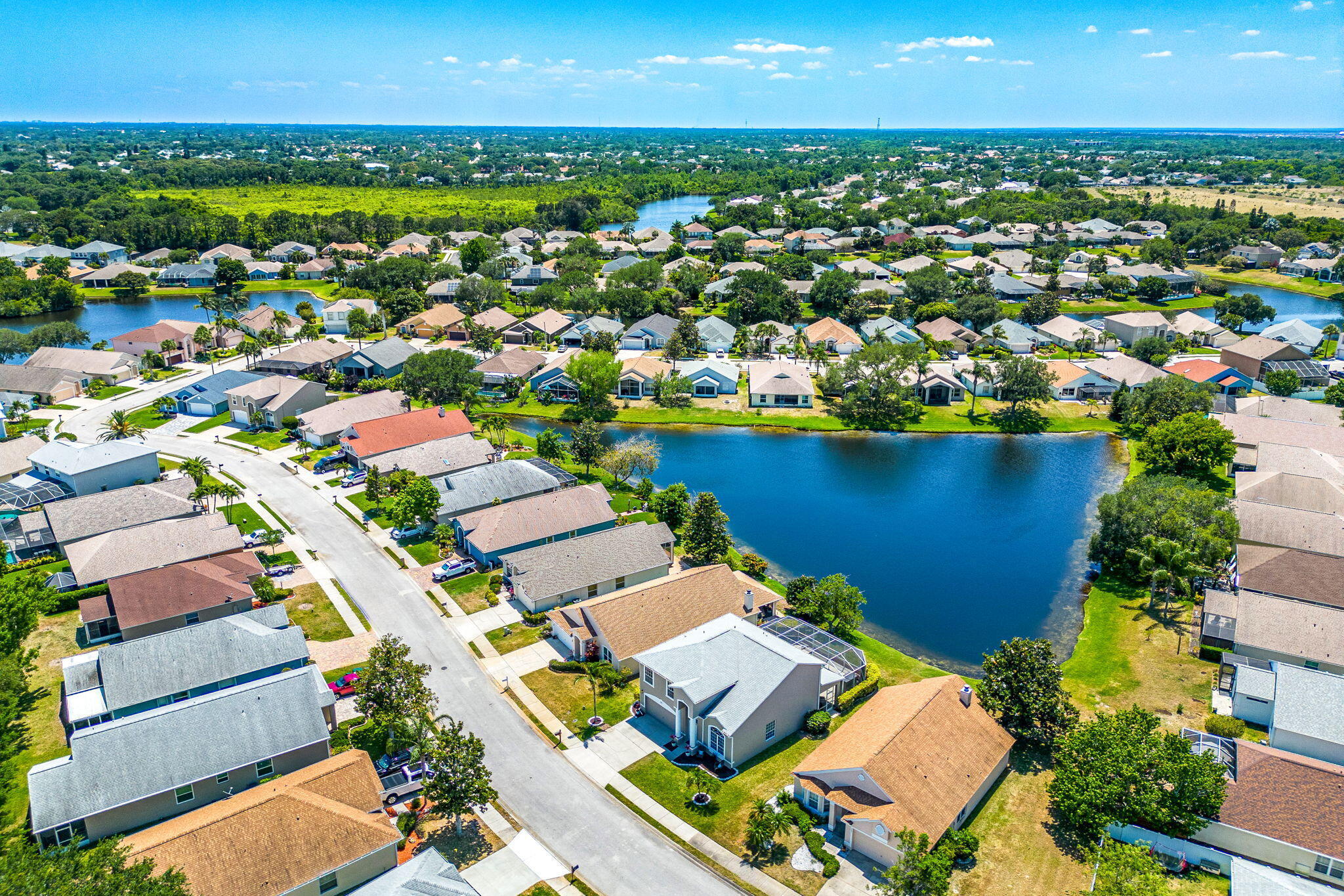 981 Shaw Circle Melbourne, FL 32940 - Photo 48 of 58 an aerial view of a house with a lake view