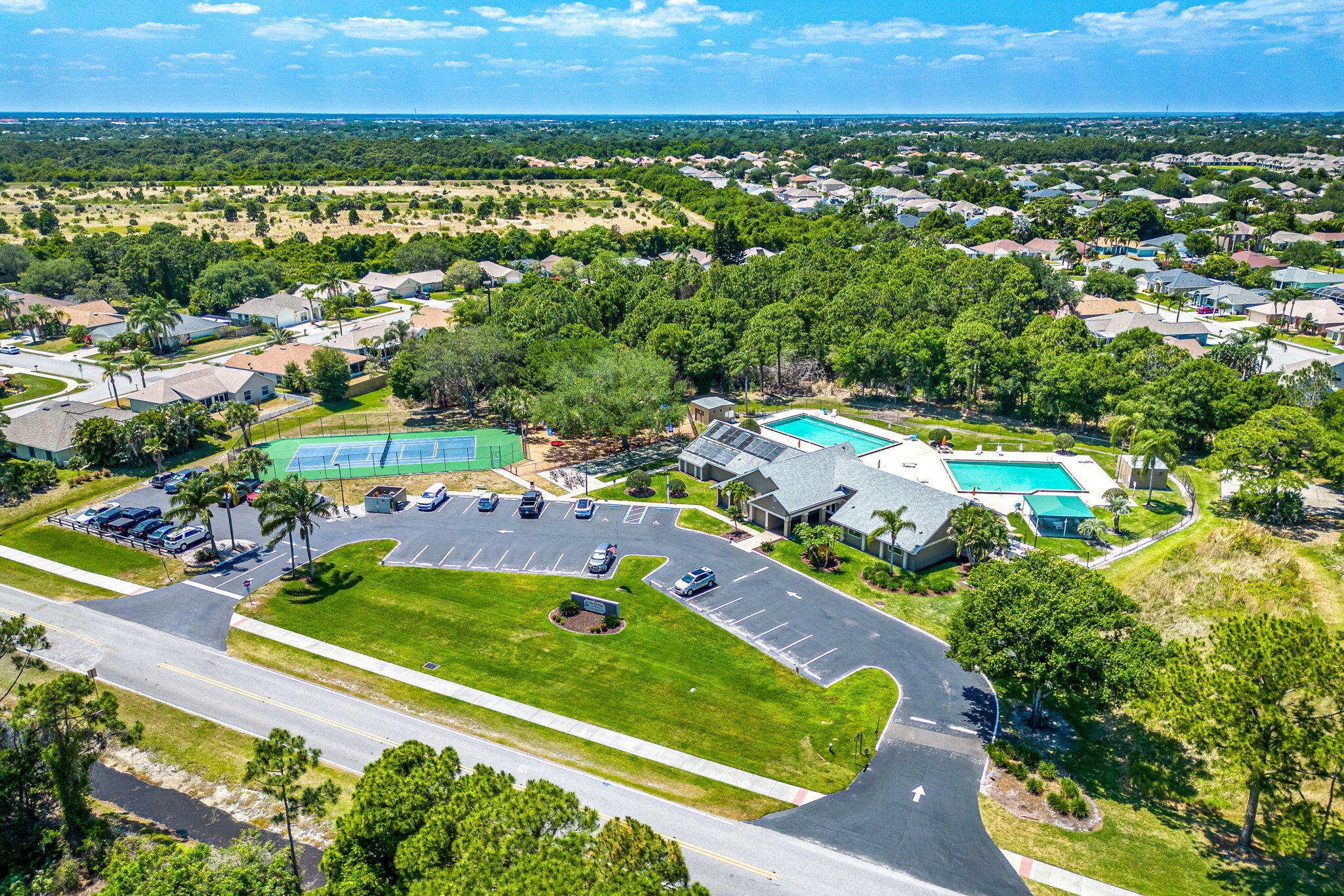981 Shaw Circle Melbourne, FL 32940 - Photo 52 of 58 an aerial view of a residential houses with a yard and lake view