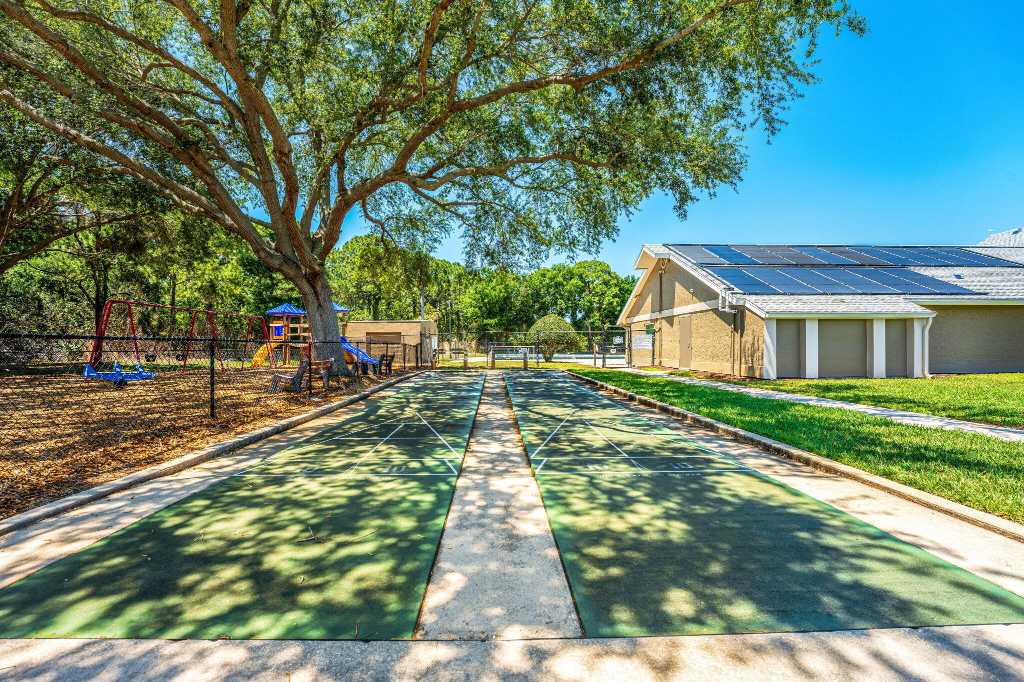 981 Shaw Circle Melbourne, FL 32940 - Photo 56 of 58 a view of a yard with plants and large trees