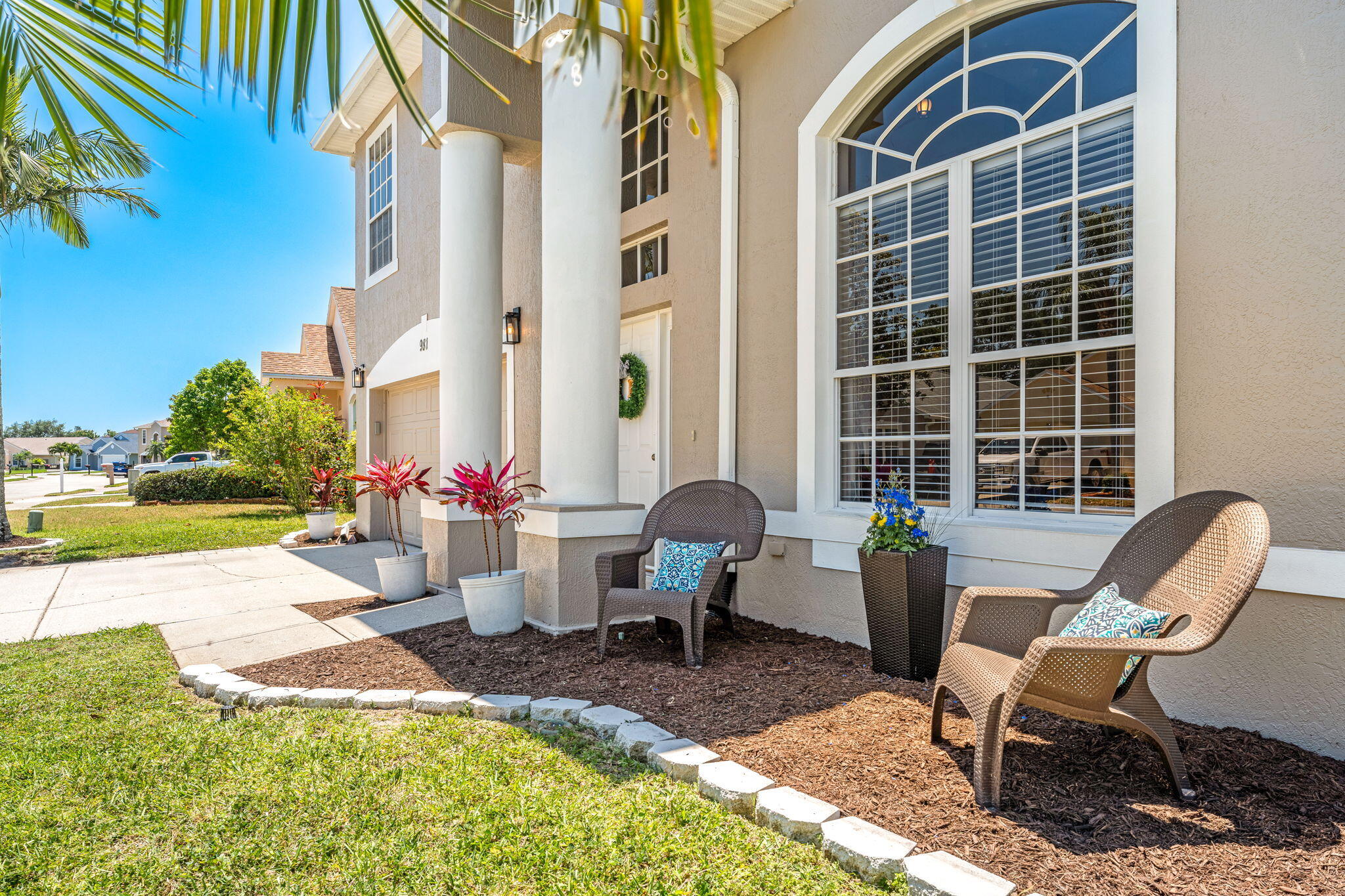 981 Shaw Circle Melbourne, FL 32940 - Photo 57 of 58 a view of a patio with table and chairs and potted plants