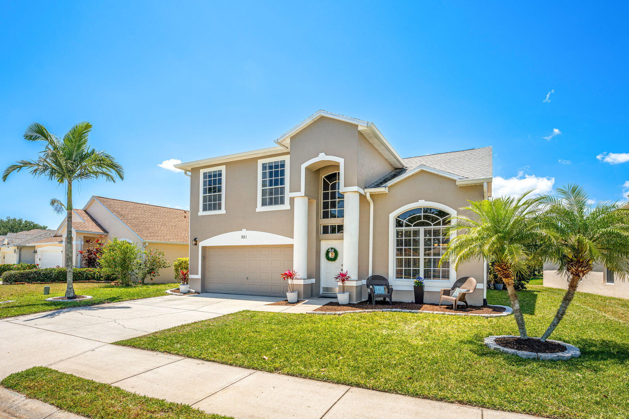981 Shaw Circle Melbourne, FL 32940 - Photo 58 of 58 a front view of a house with garden