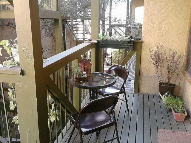 806 West 24th Street, Unit 233 Austin, TX 78705 - Photo 4 of 5 a view of balcony with furniture and wooden floor