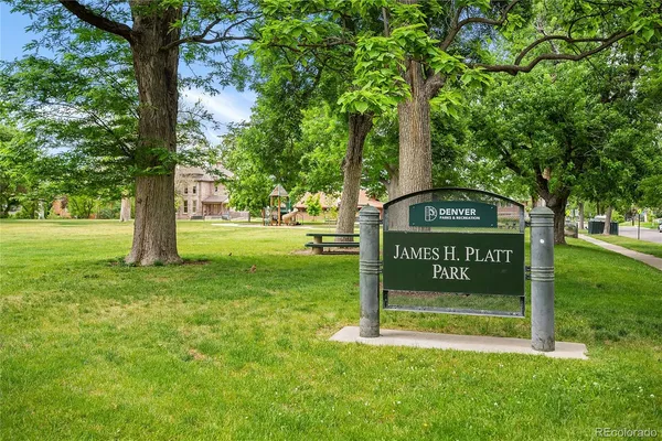 a view of a park that has sign board