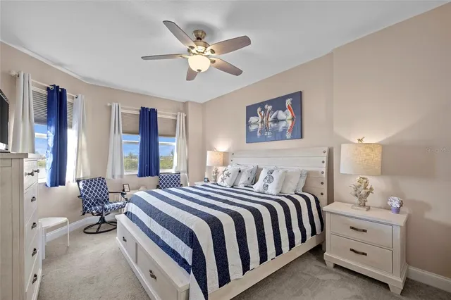 a spacious bedroom with a bed and window