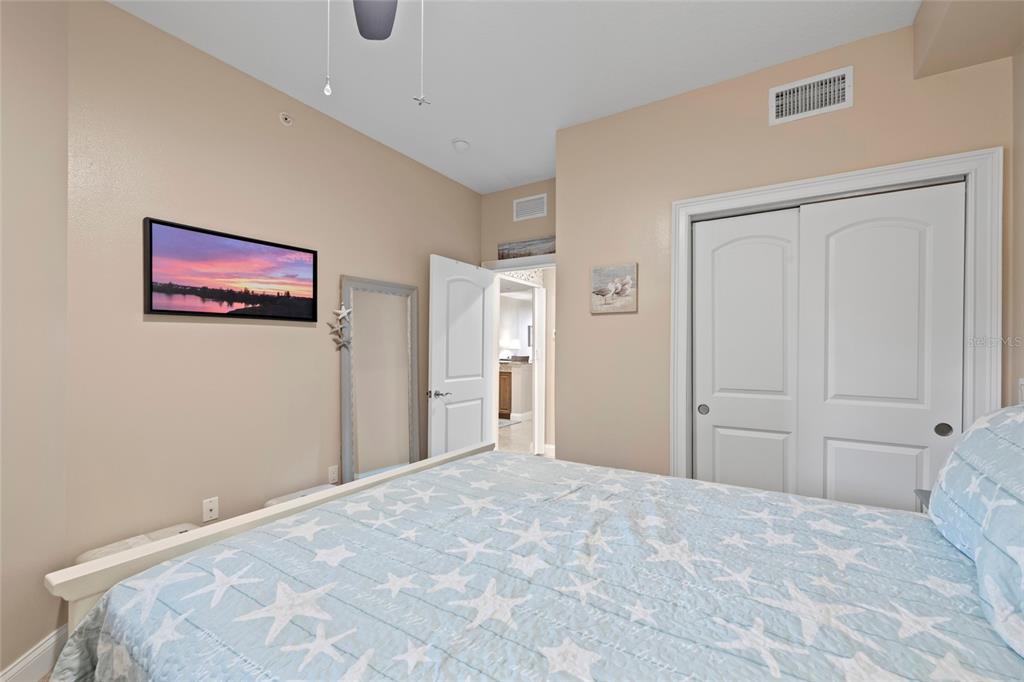 615 Riviera Dunes Way, Unit 204 Palmetto, FL 34221 - Photo 26 of 43 a bedroom with a large bed