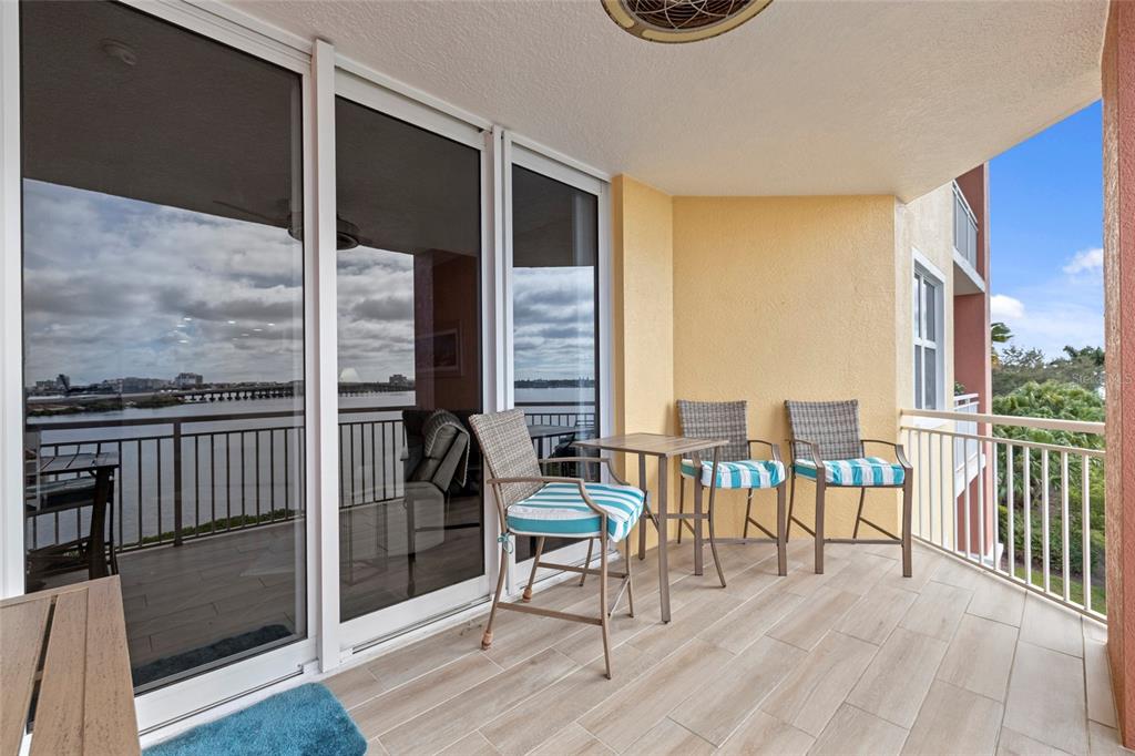 615 Riviera Dunes Way, Unit 204 Palmetto, FL 34221 - Photo 33 of 43 an outdoor living space with furniture and floor to ceiling window