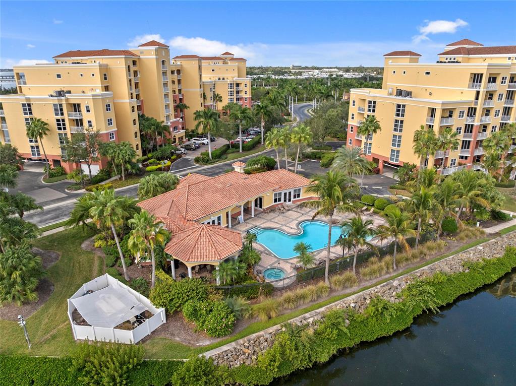 615 Riviera Dunes Way, Unit 204 Palmetto, FL 34221 - Photo 38 of 43 an aerial view of multiple houses with yard
