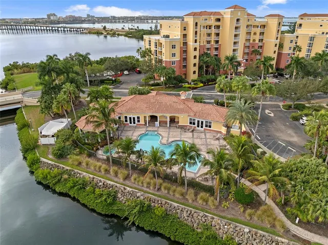 an aerial view of residential building and lake