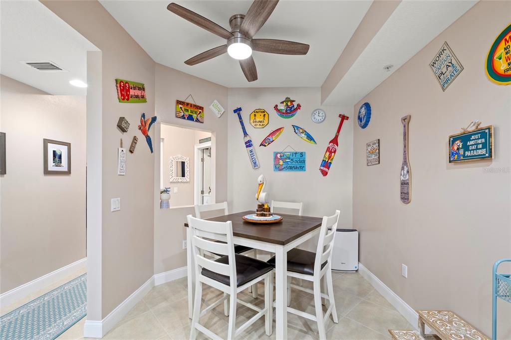 615 Riviera Dunes Way, Unit 204 Palmetto, FL 34221 - Photo 6 of 43 a dining room with furniture and window