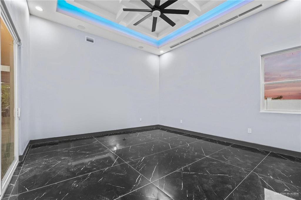 2321 Martha's Lane Mission, TX 78573 - Photo 16 of 36 Primary room featuring a raised ceiling and coffered ceiling