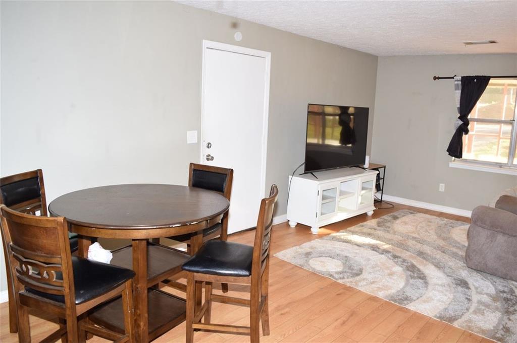 705 Triune Mill Road Thomaston, GA 30286 - Photo 13 of 39 a bedroom with a bed and a chair