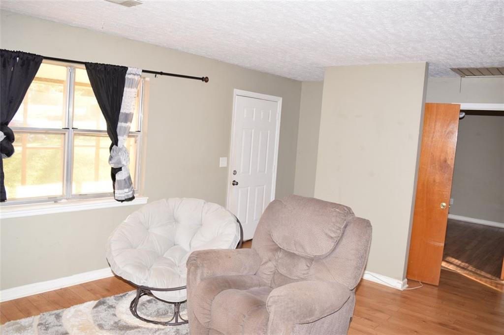 705 Triune Mill Road Thomaston, GA 30286 - Photo 14 of 39 a balcony with table and chair