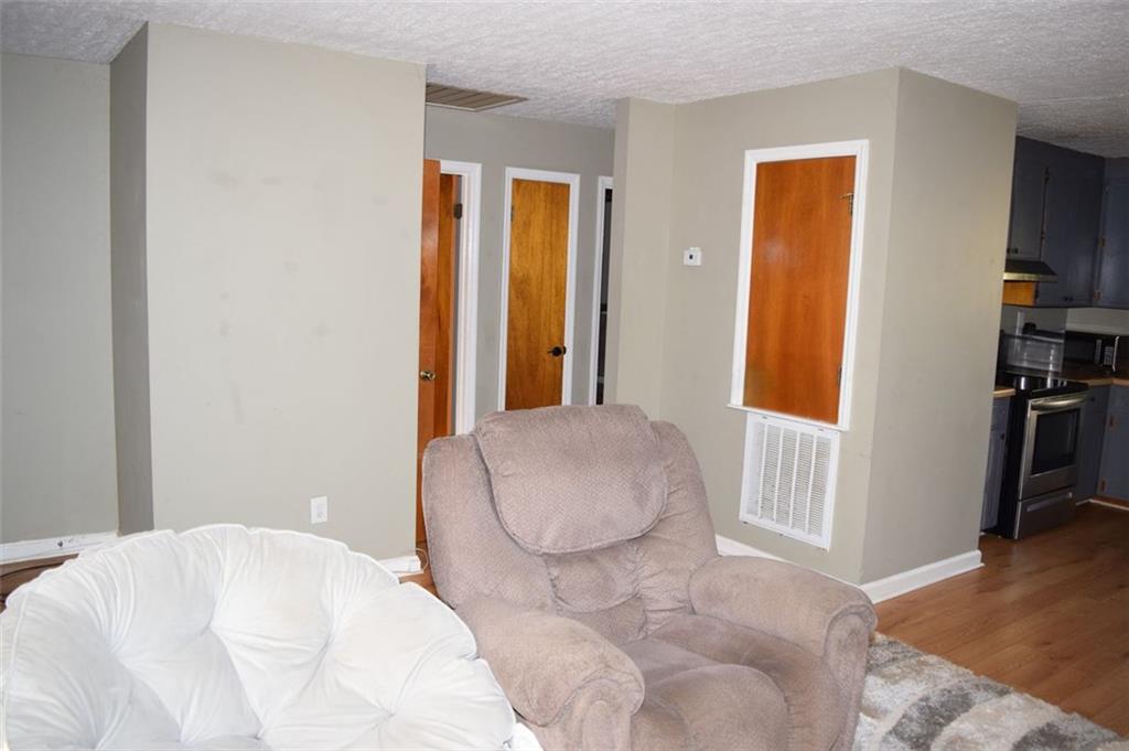 705 Triune Mill Road Thomaston, GA 30286 - Photo 16 of 39 a bedroom with a bed and a window