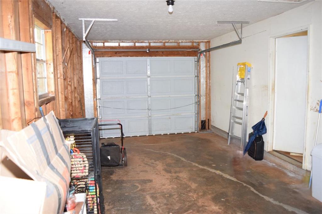 705 Triune Mill Road Thomaston, GA 30286 - Photo 31 of 39 a view of empty room with wooden floor and fan