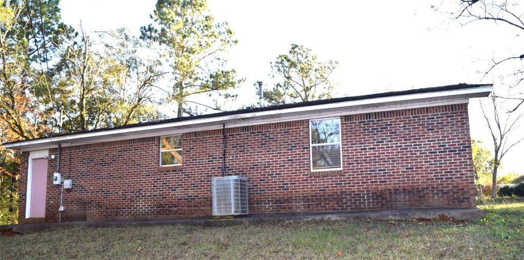 705 Triune Mill Road Thomaston, GA 30286 - Photo 34 of 39 a view of a brick house with large windows