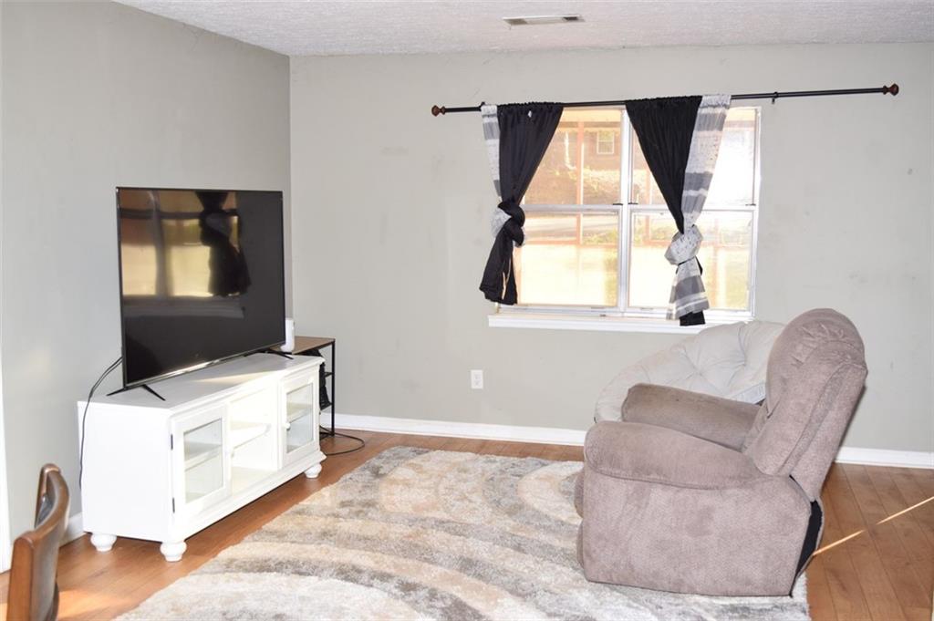 705 Triune Mill Road Thomaston, GA 30286 - Photo 5 of 39 a living room with a couch and a window