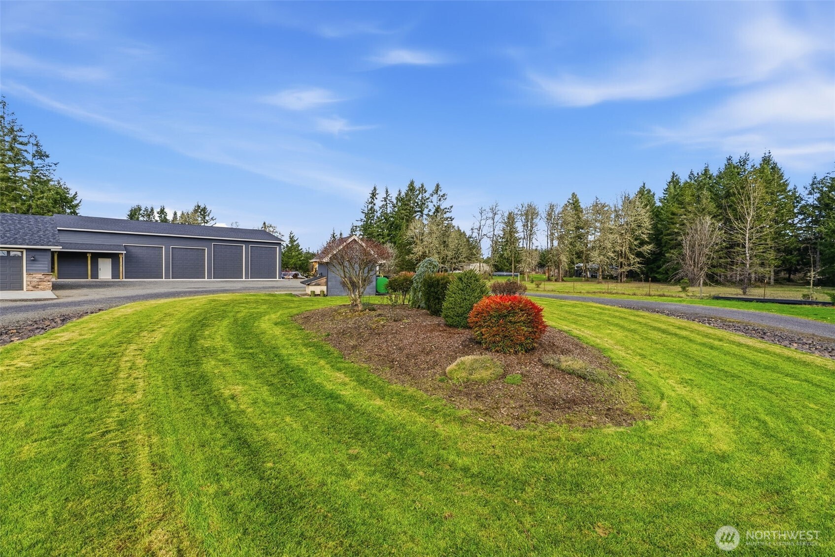 371 Toledo-Vader Road Toledo, WA 98591 - Photo 11 of 40 a backyard of a house with table and chairs plants and large tree