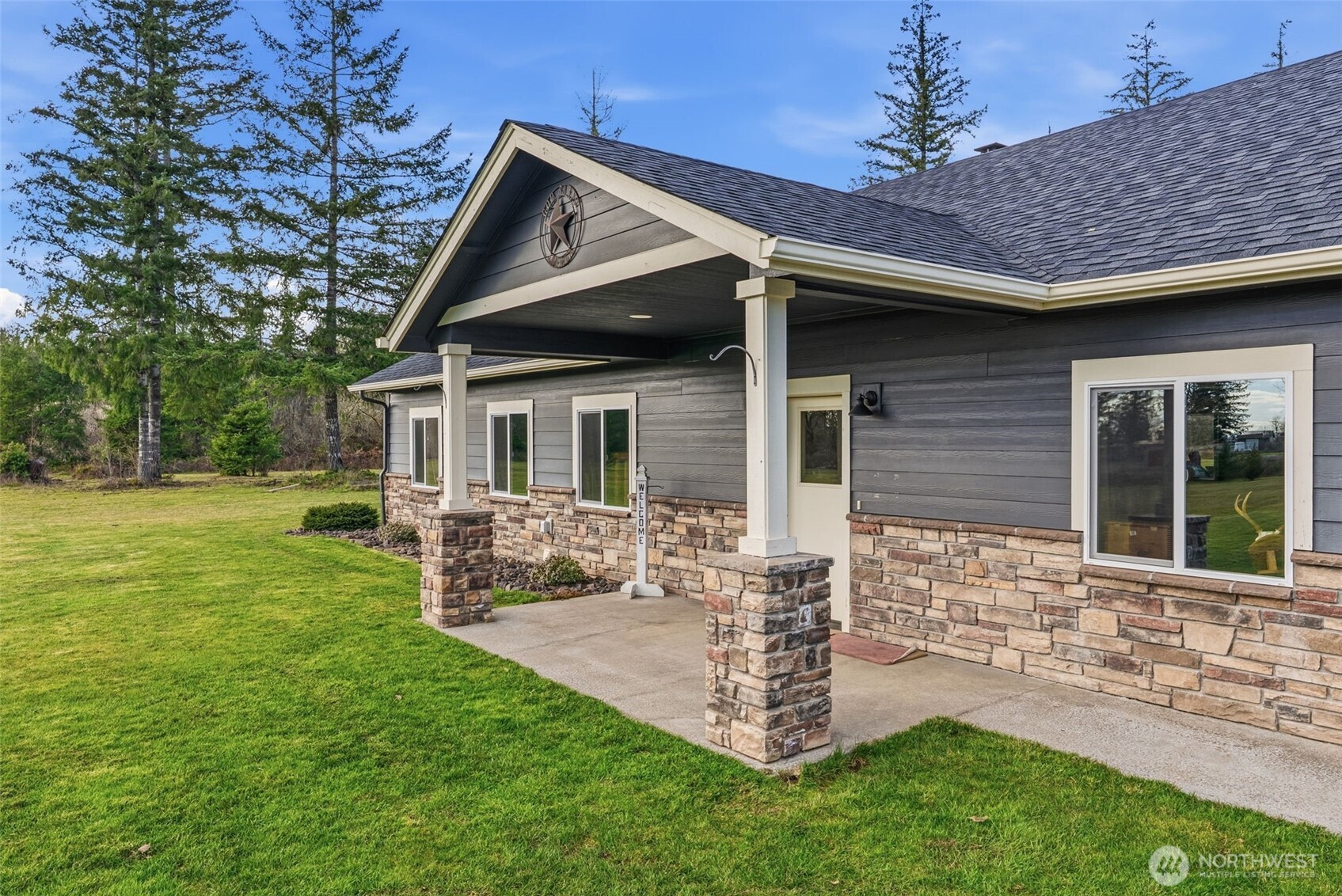 371 Toledo-Vader Road Toledo, WA 98591 - Photo 14 of 40 a front view of a house with a yard and outdoor seating