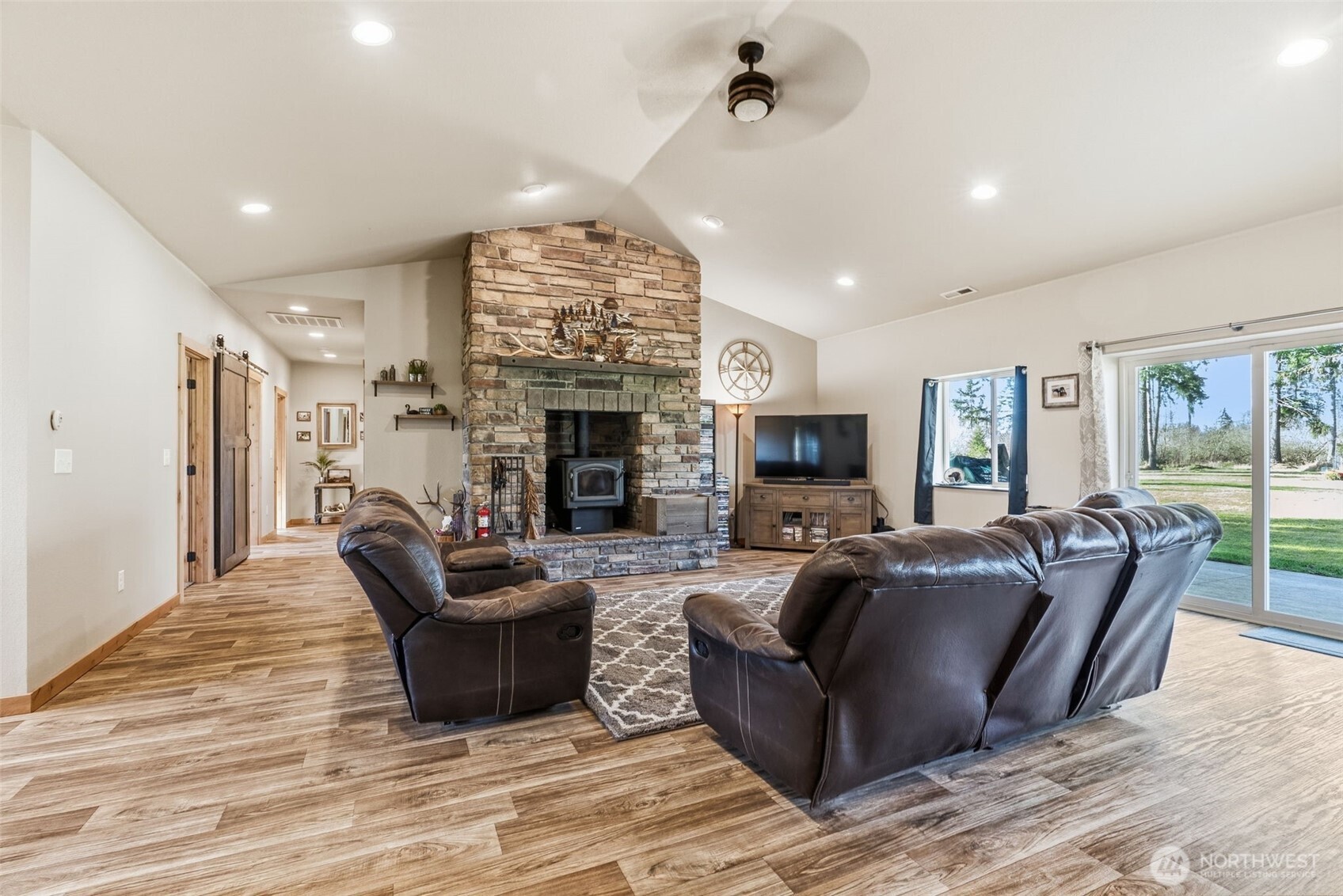 371 Toledo-Vader Road Toledo, WA 98591 - Photo 15 of 40 a living room with furniture a fireplace and a chandelier
