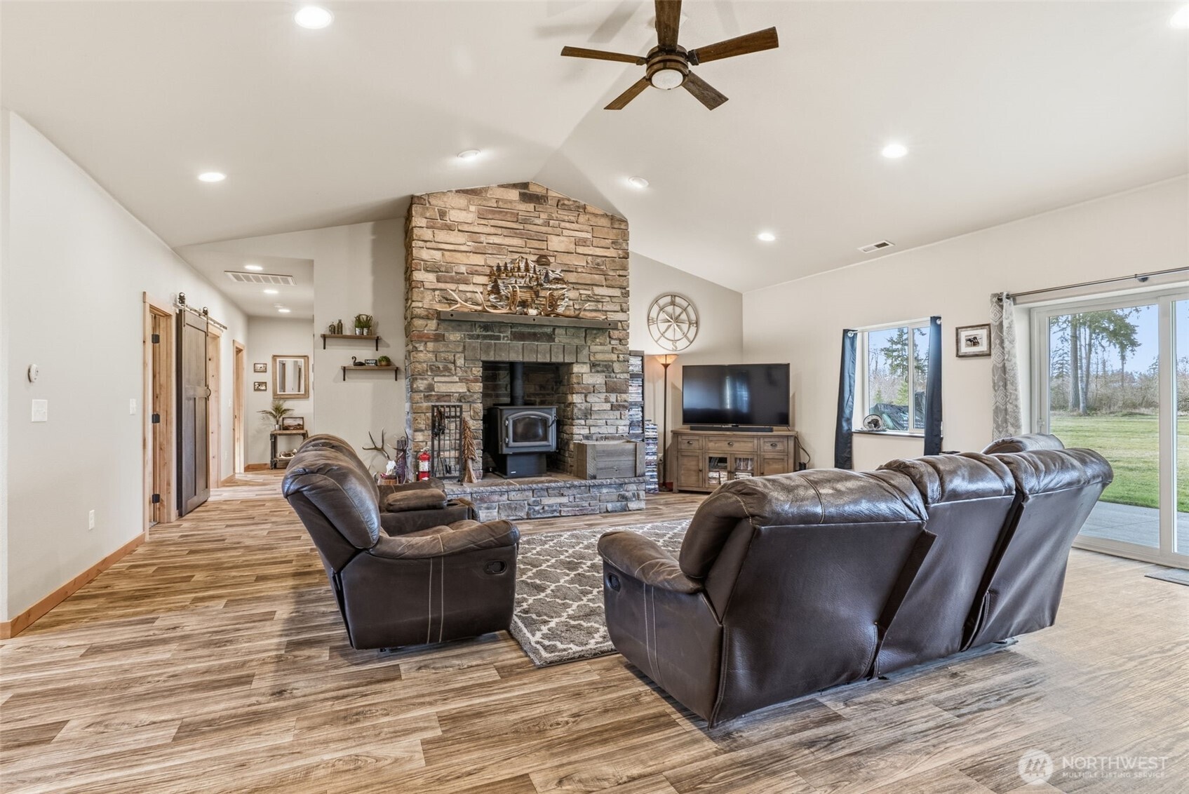 371 Toledo-Vader Road Toledo, WA 98591 - Photo 21 of 40 a living room with furniture a fireplace and a flat screen tv