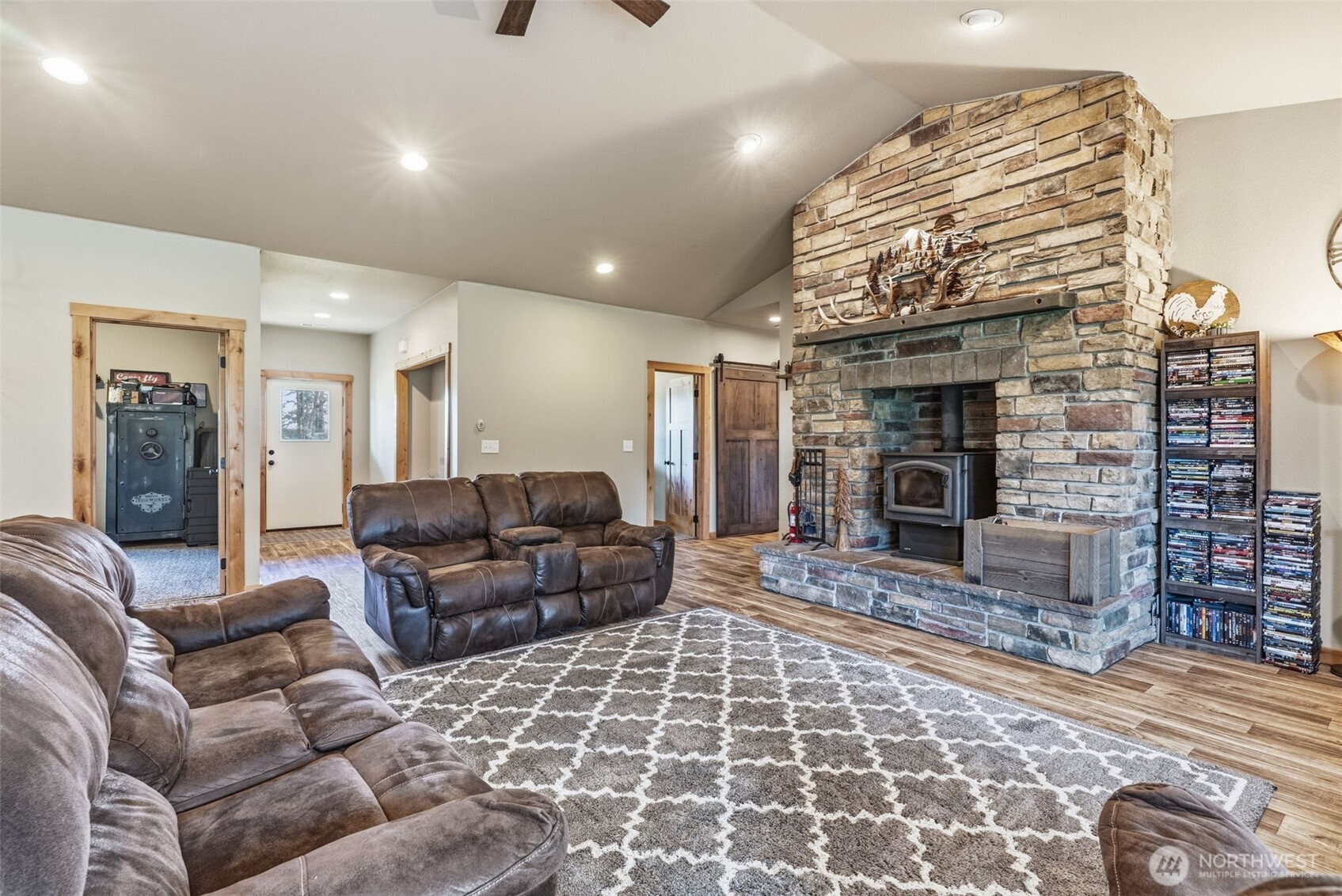 371 Toledo-Vader Road Toledo, WA 98591 - Photo 22 of 40 a living room with furniture a flat screen tv and a fireplace