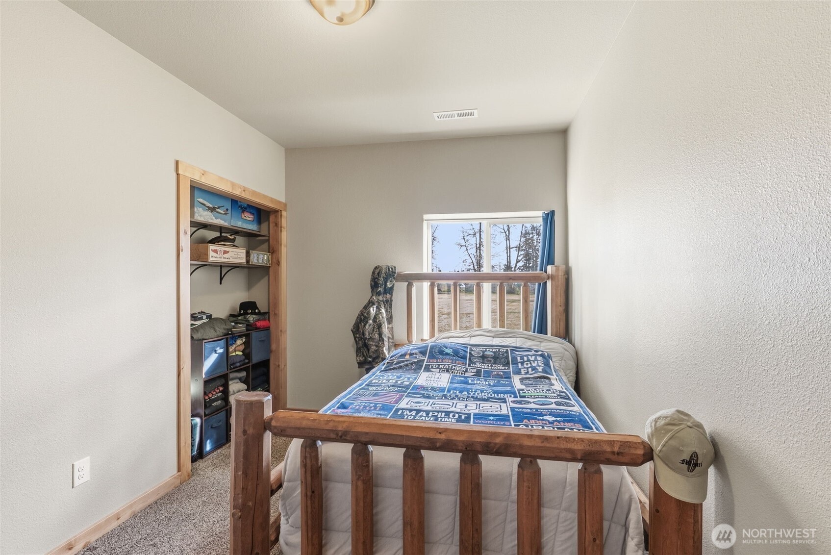 371 Toledo-Vader Road Toledo, WA 98591 - Photo 25 of 40 a bedroom with a bed and a book shelf