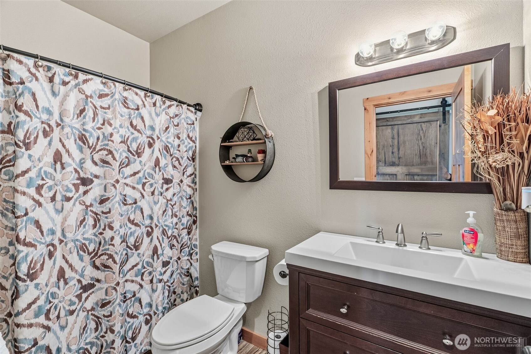 371 Toledo-Vader Road Toledo, WA 98591 - Photo 26 of 40 a bathroom with a toilet a sink and a mirror