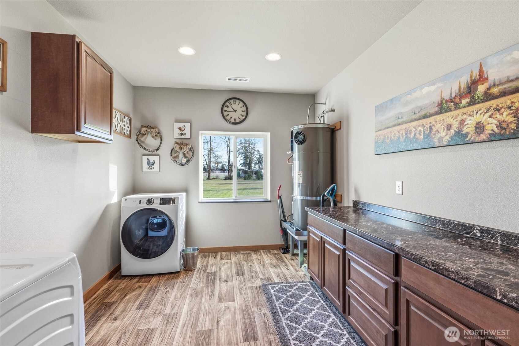 371 Toledo-Vader Road Toledo, WA 98591 - Photo 27 of 40 a view of a kitchen with fridge and wooden floor