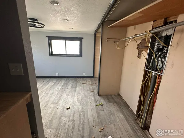a room with a sink cabinets and window