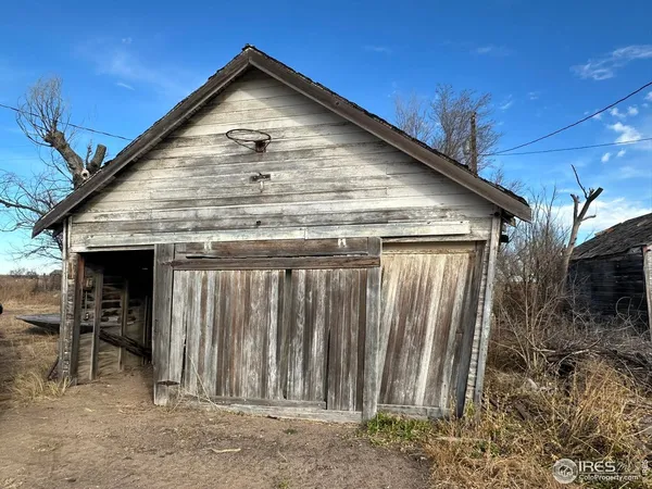 a view of balcony with wooden floor and fence