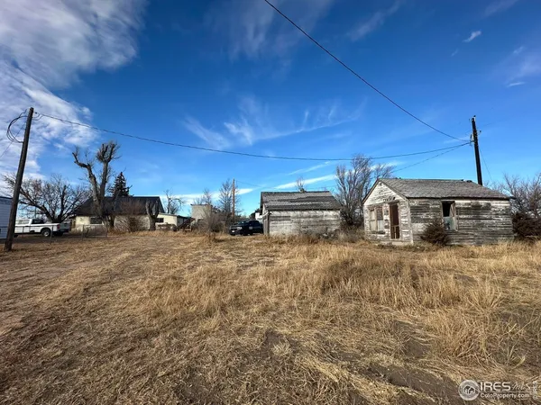 a front view of a house with parking area