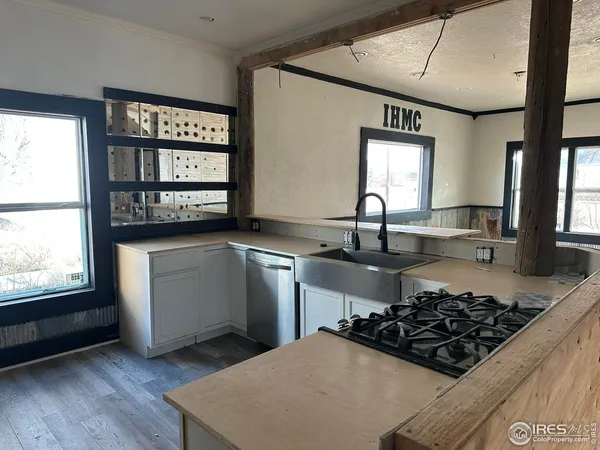 a view of walk in closet with empty room