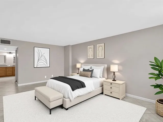 a bedroom with a bed and a couch