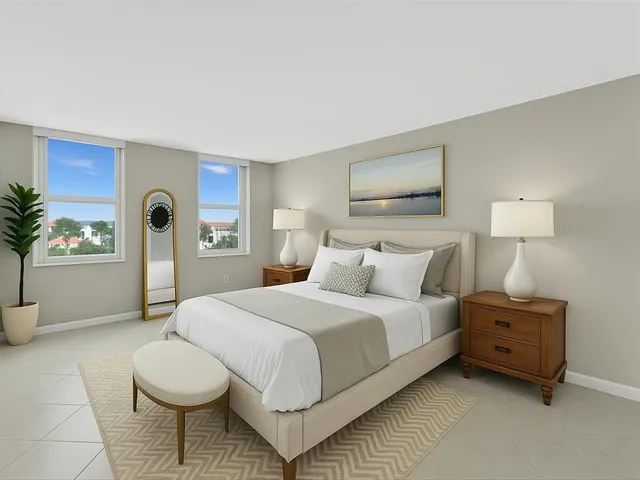 a bedroom with a bed and a potted plant