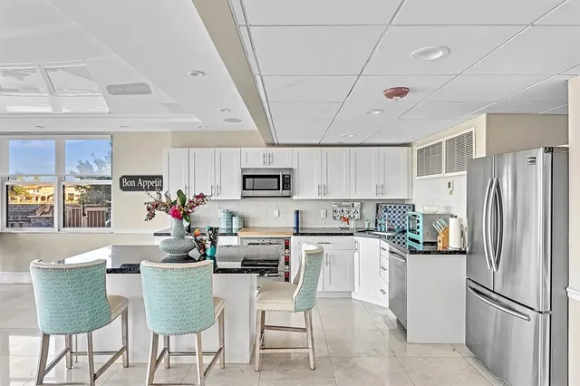 a room with furniture and pool table