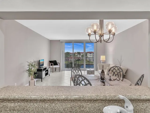 a view of living room with furniture and a chandelier