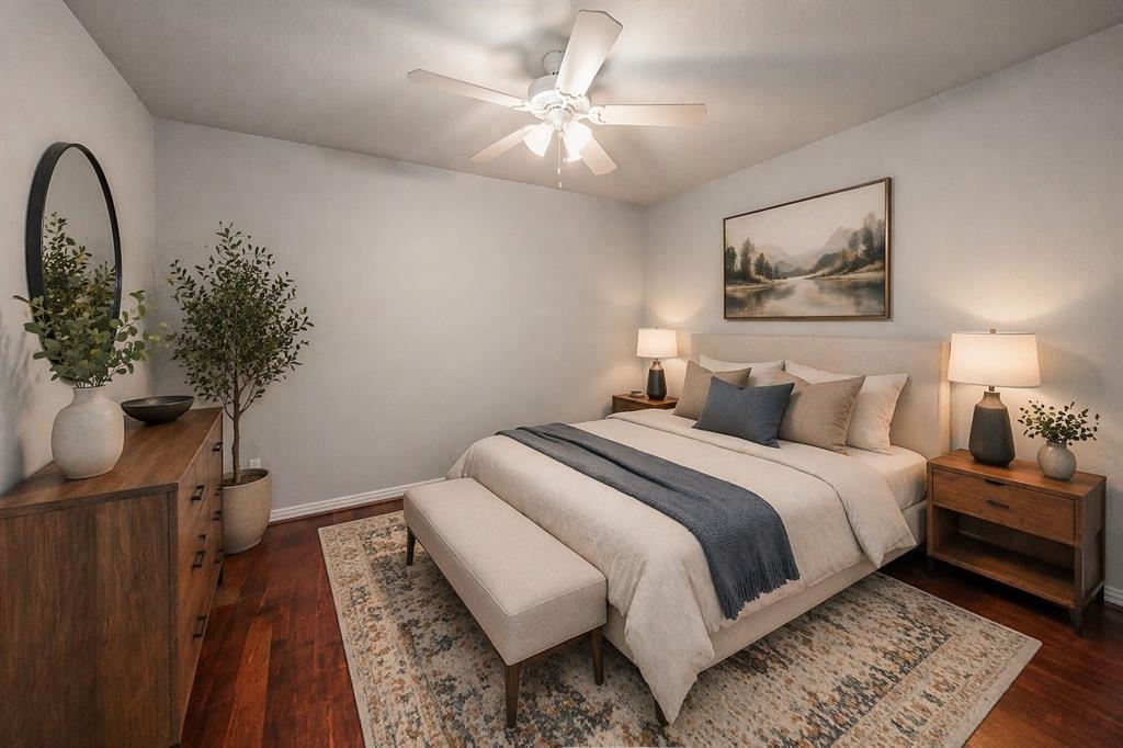 7253 Bianca Lane Plano, TX 75093 - Photo 4 of 18 a bedroom with a large bed and a chandelier