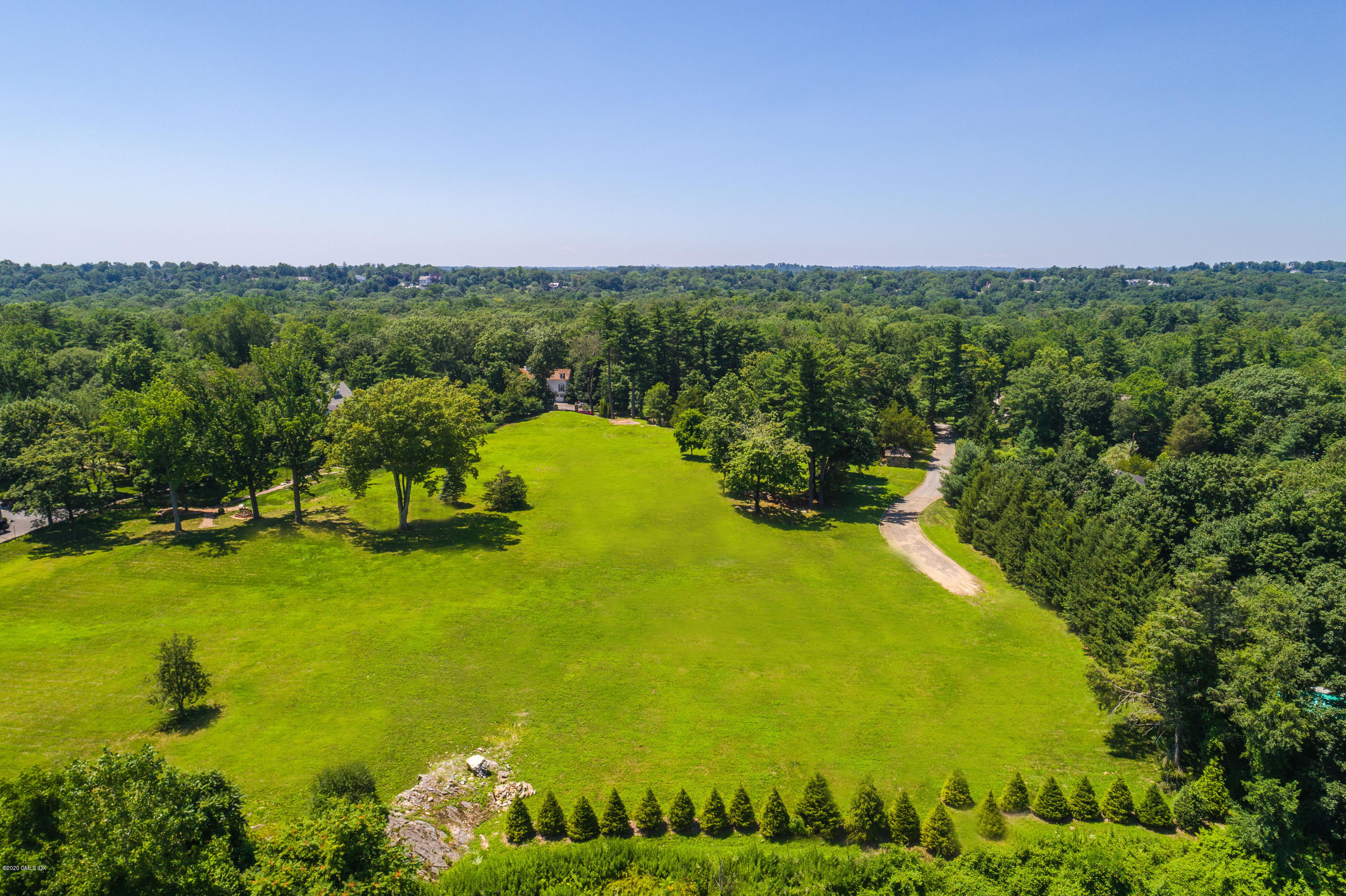 137 Doubling Road Greenwich, CT 06830 - Photo 1 of 12 a view of a lake with a houses