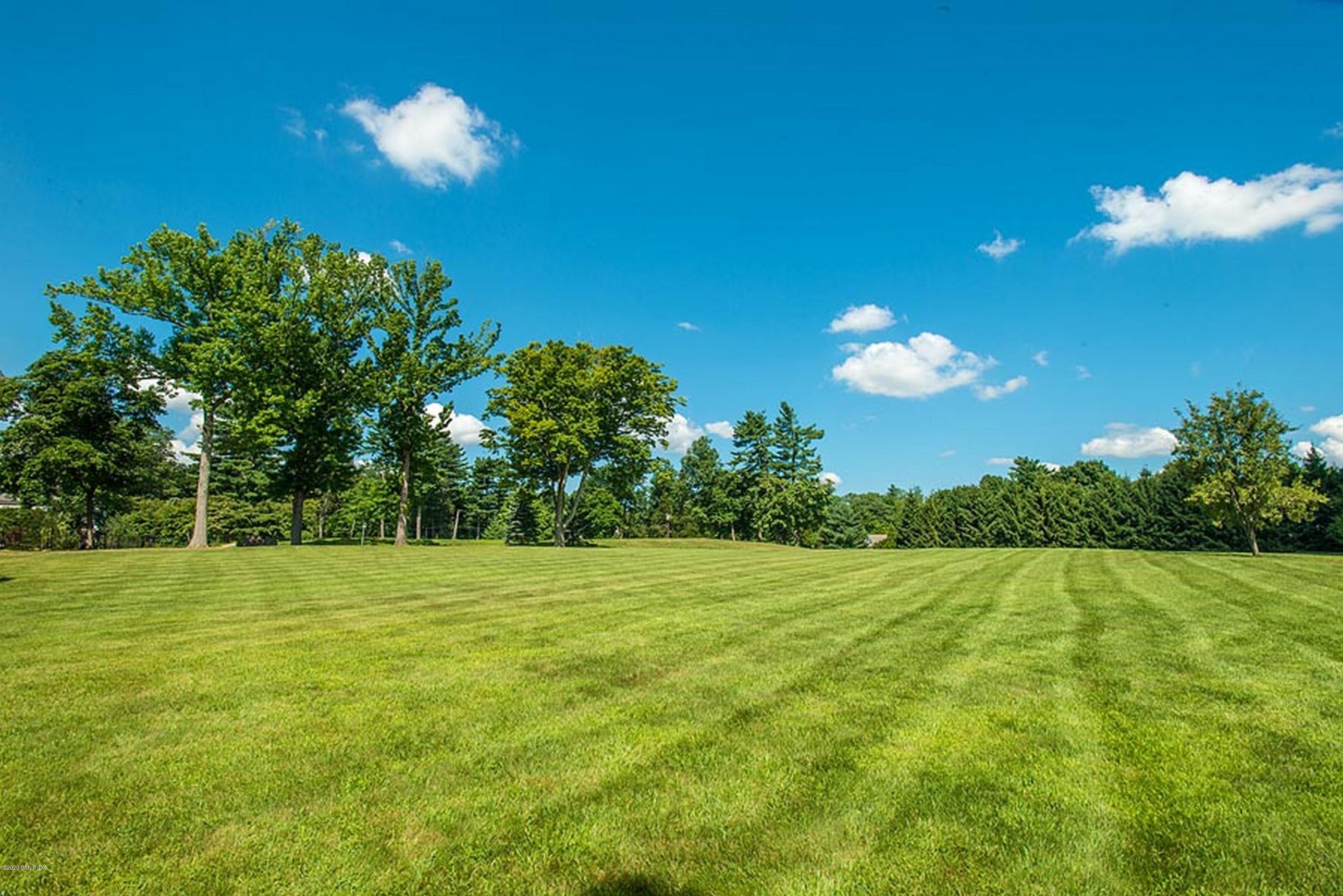 137 Doubling Road Greenwich, CT 06830 - Photo 2 of 12 a view of a golf course with a tree
