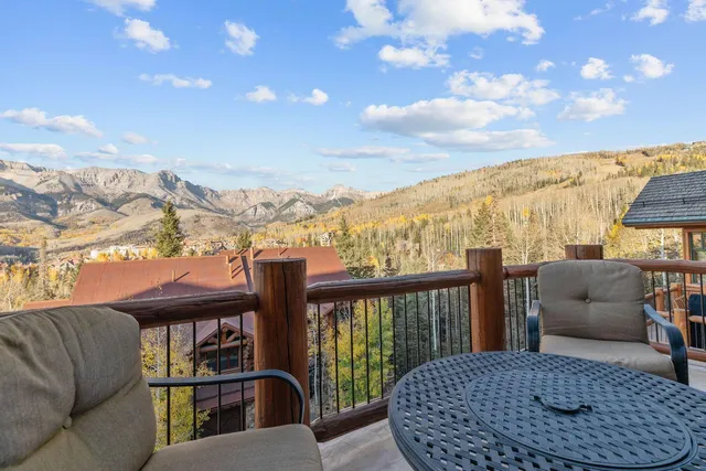 a spacious bedroom with a bed and a couch