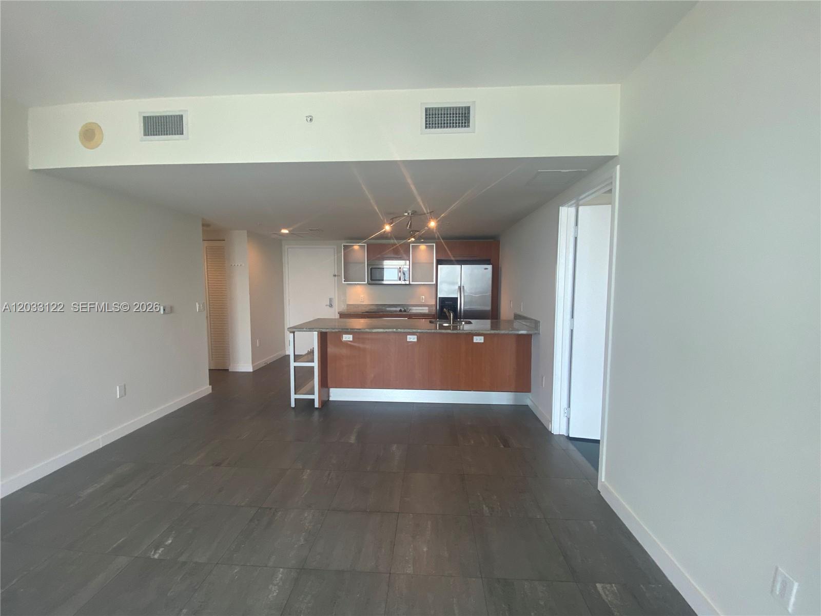 185 Southwest 7th Street, Unit 4206 Miami, FL 33130 - Photo 2 of 26 a view of kitchen and window