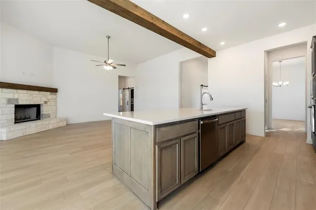 a kitchen with a sink and cabinets