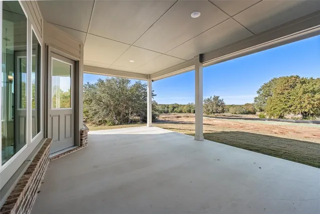 a view of a room with floor to ceiling windows