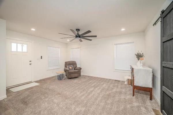 a view of empty room with ceiling fan