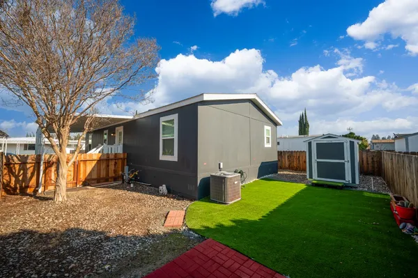 a view of a backyard with a sitting area