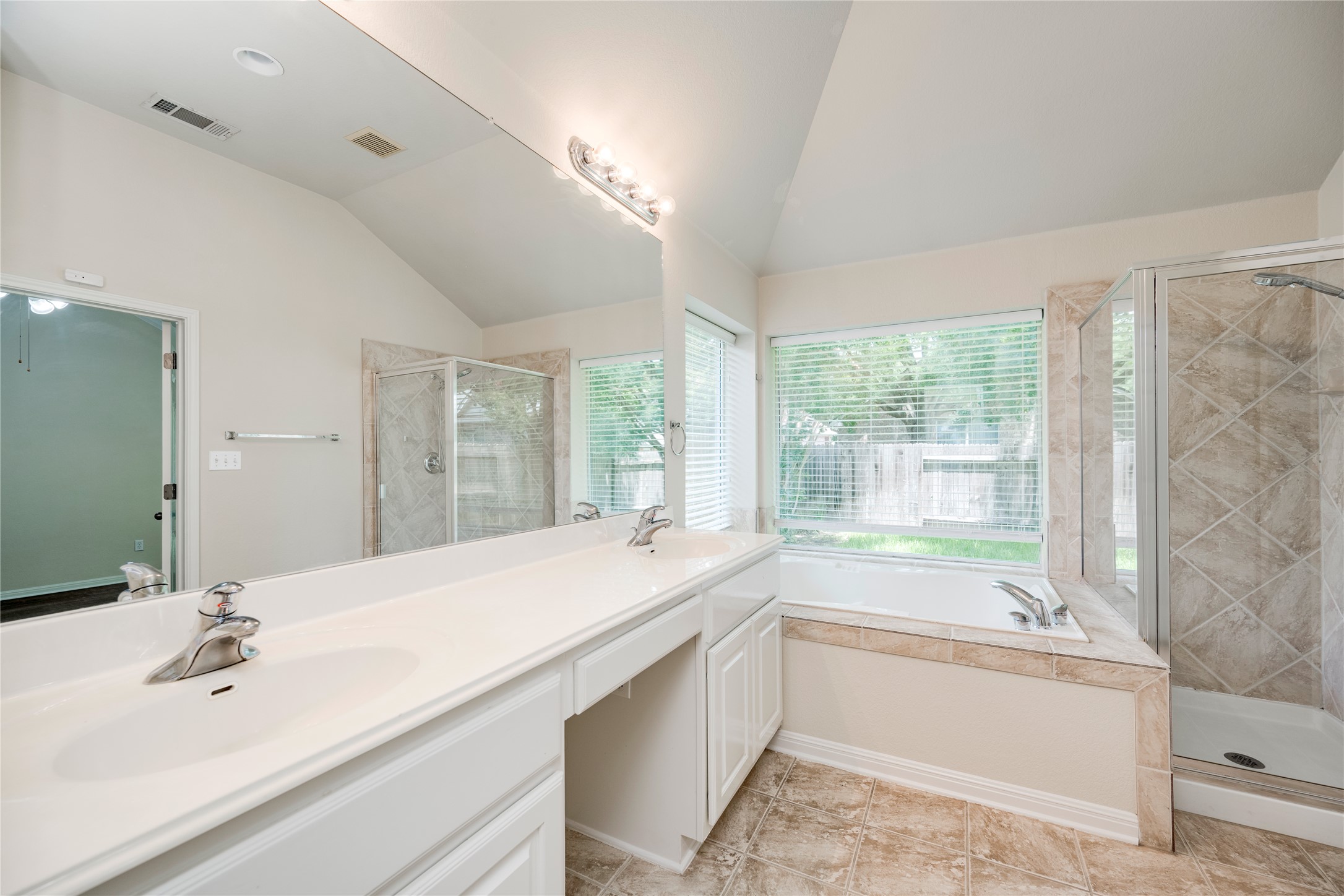 1813 Nelson Ranch Loop Cedar Park, TX 78613 - Photo 20 of 39 Indulge in this well-appointed bathroom featuring a double vanity, a soaking tub, and a separate shower.