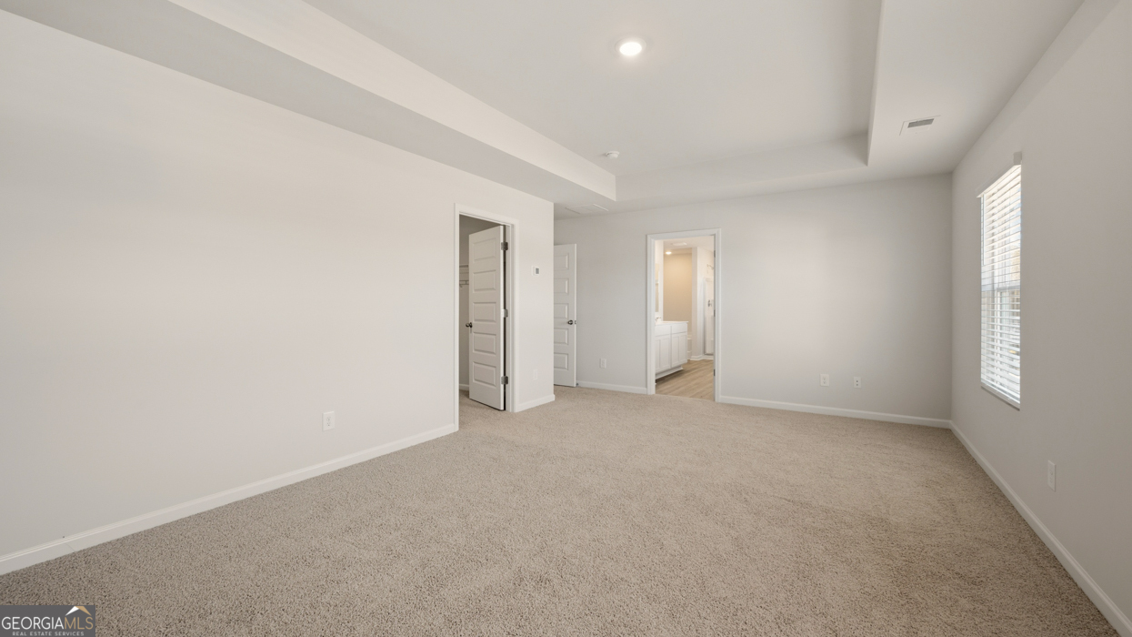 8578 Seabiscuit Road Lithonia, GA 30058 - Photo 22 of 30 a view of an empty room with a window