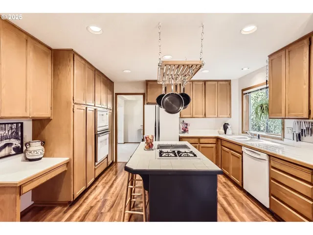 a open kitchen with stainless steel appliances granite countertop a sink stove and refrigerator