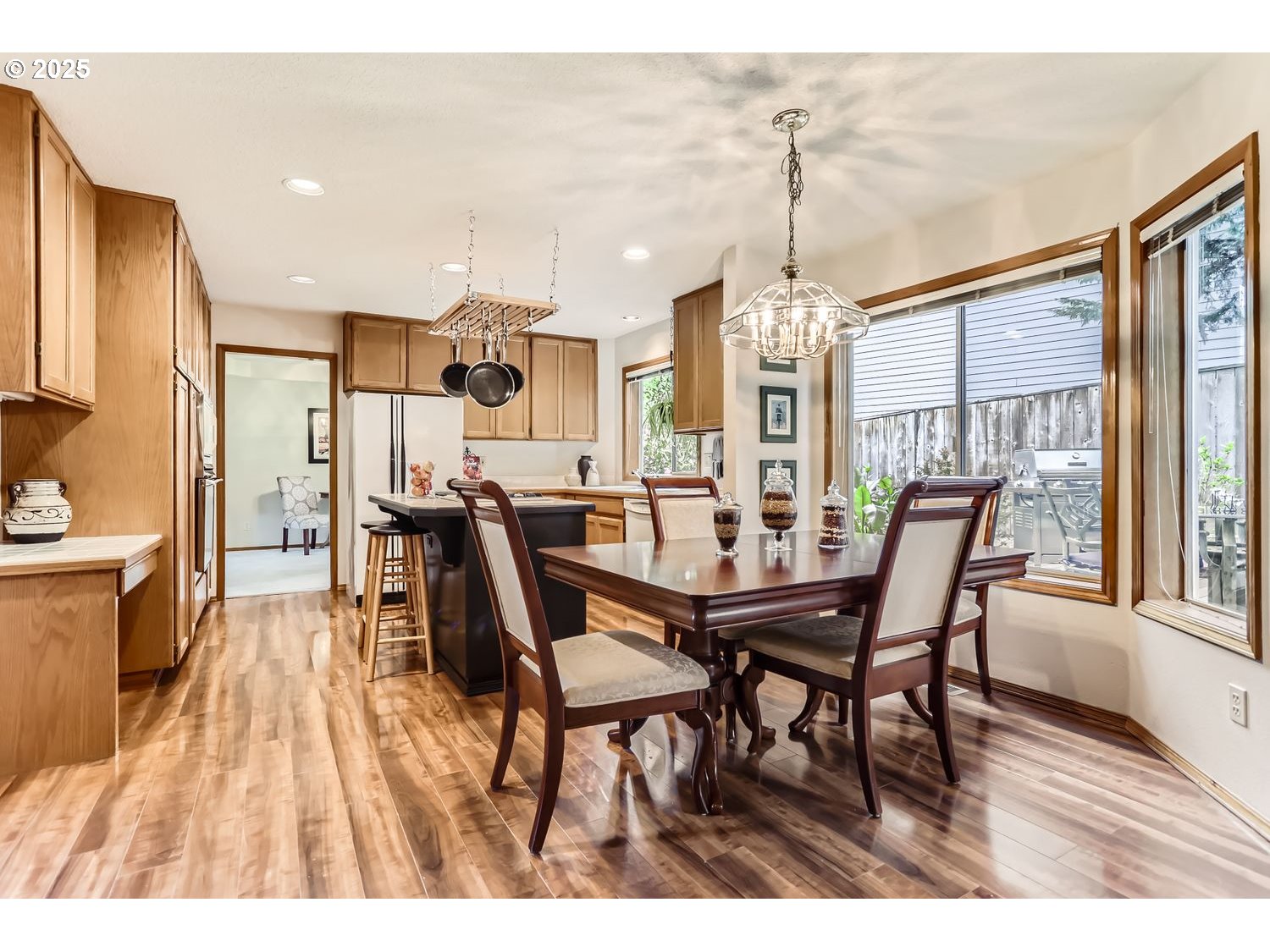 14525 Southwest Chesterfield Lane Portland, OR 97224 - Photo 12 of 31 a dining room filled with furniture and wooden floor